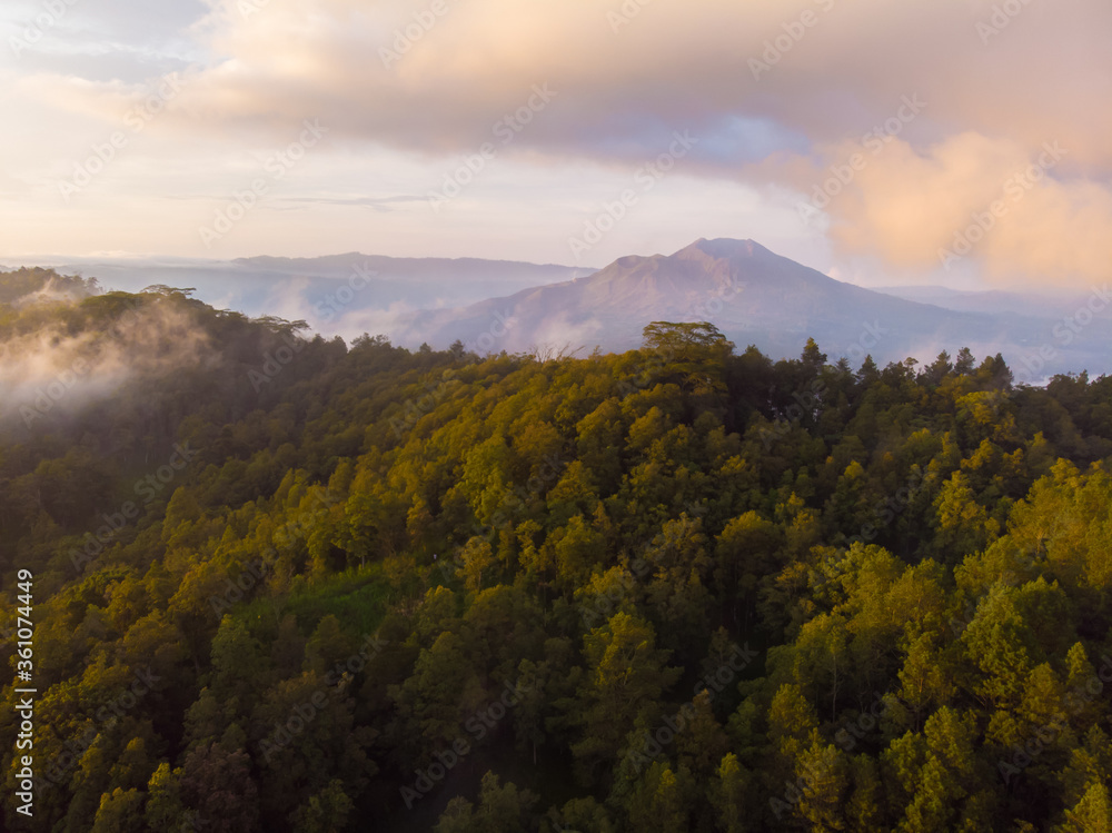 Aerial view of mount Batur and lake Batur in the evening with the evaporation of clouds. Aerial view of mount Batur and lake Batur in the evening with the evaporation of clouds.