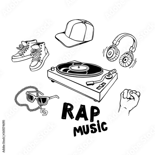 Rap music set with vinyl record player and various rapper style clothes and accessories.