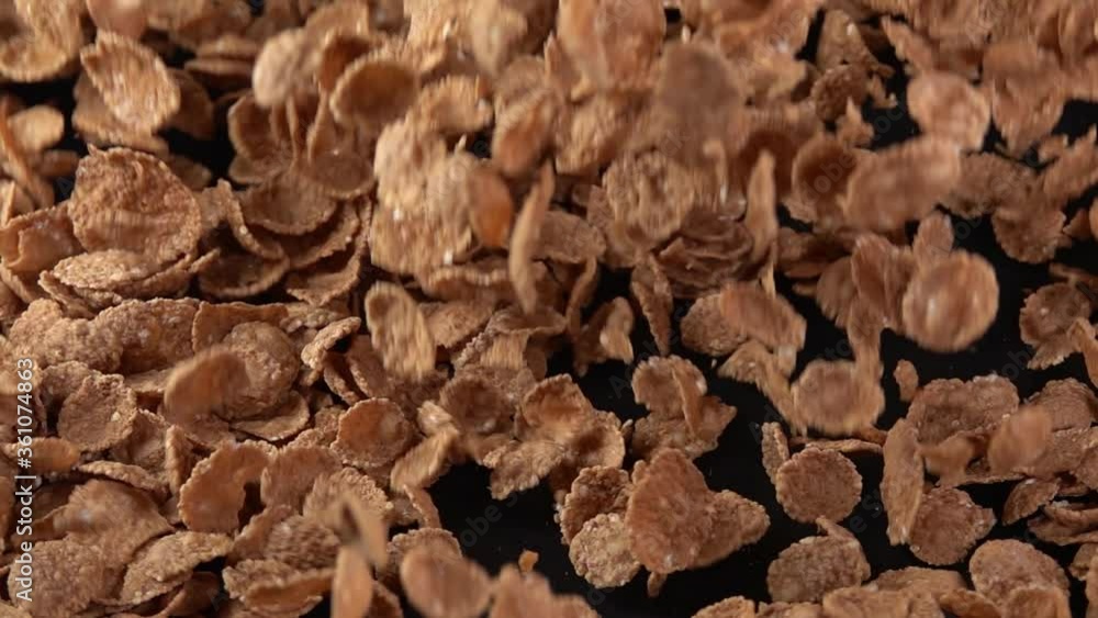 Explosion of wheat flakes on a black background. Slow motion 250 fps Explosion of wheat flakes on a black background. Slow motion 250 fps