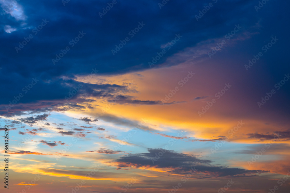 Colorful sunset. Dramatic sky background with dark clouds.  Abstract natural sky background.