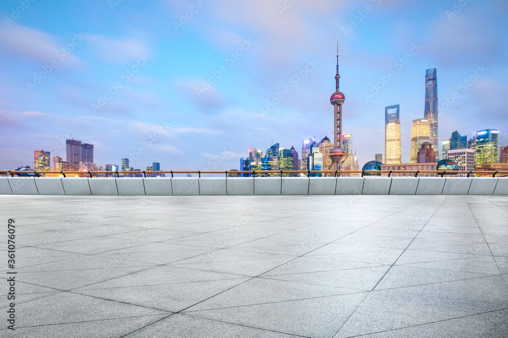 Empty square floor and Shanghai Lujiazui commercial building scenery at sunset,China.