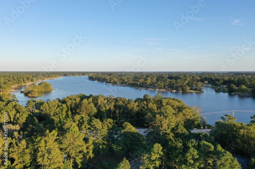 Fototapeta Naklejka Na Ścianę i Meble -  DJI Drone Aerial View Overlooking Lake And Trees