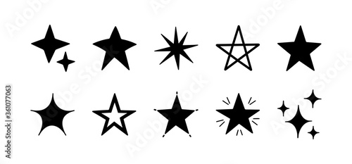 Set with hand drawn vector stars. Sparkles icon set. Stars  decoration elements for party and celebration. Vector illustration. Cute outline black stars isolated on white background