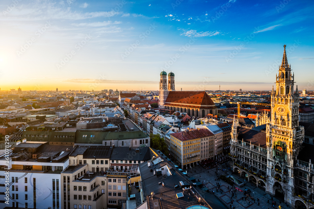 Aerial view of Munich - Marienplatz, Neues Rathaus and Frauenkirche from St. Peter's church on sunset. Munich, Germany - obrazy, fototapety, plakaty 