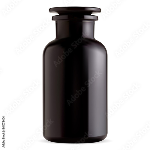 Old apothecary bottle. Black glass vintage pharmacy vial from chemical laboratory. Antique potion jar. Pharmaceutical medication or bath salt container