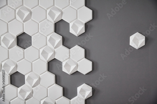 wall background. background texture. wall with textured hexagons. the honeycomb on the wall. gray wall