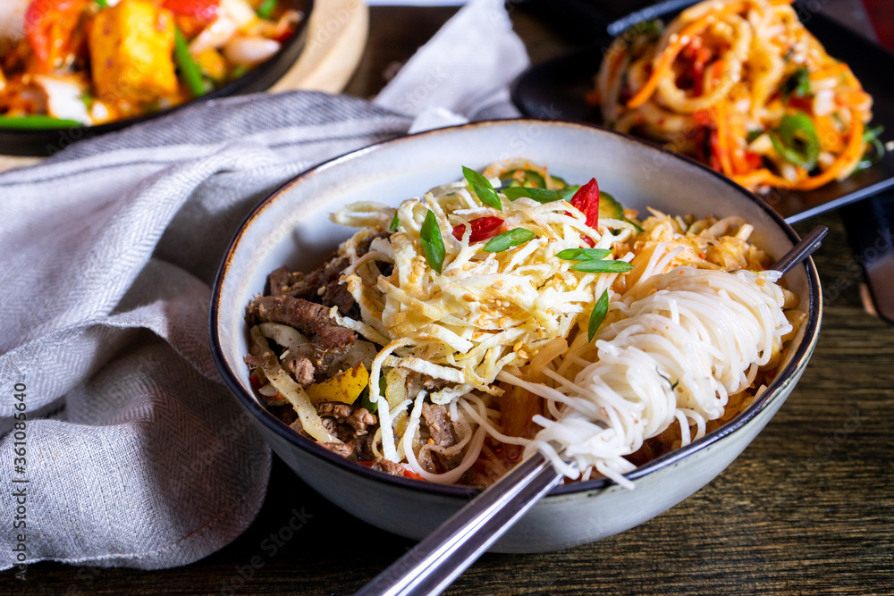 Korean traditional food on table with noodles and meat Korean traditional food on table with noodles and meat