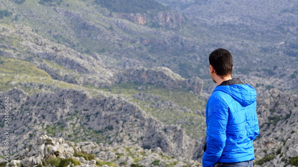 a hiker in Sa Calobra, Torrent de Pareis, Mallorca, Spain, in the month of January