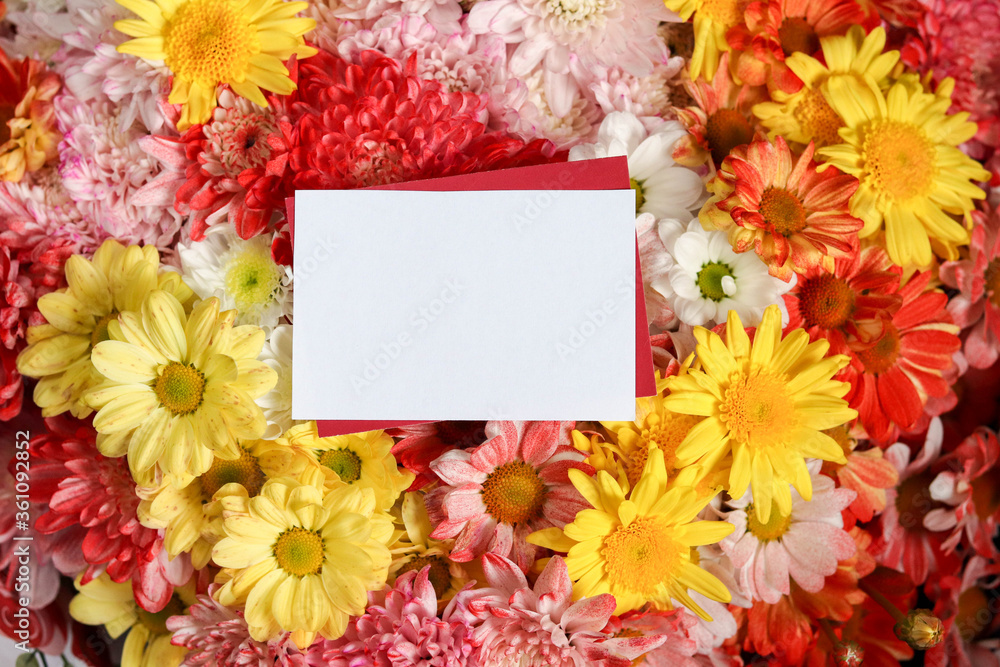 Obraz premium framework for invitation or congratulation. postcard mockup. flower composition. bouquet of colorful flowers and an envelope with place for text.