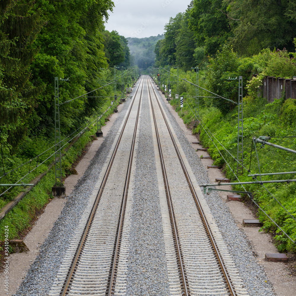 High angle view of two railway tracks leading into the distance. Symbol for travel.