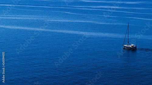 Aerial view of a sailing boat in a calm sea in Greece photo