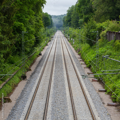 High angle view of two railway tracks leading into the distance. Symbol for travel.