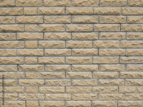 wall of beige brick - background. Horizontal texture
