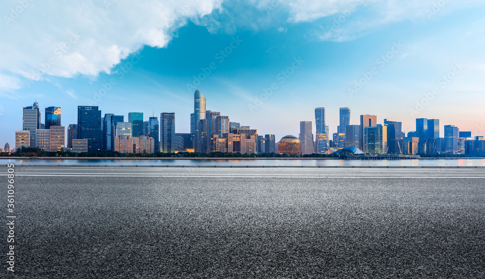 Hangzhou city skyline and buildings with asphalt road at sunrise,China. Hangzhou city skyline and buildings with asphalt road at sunrise,China.
