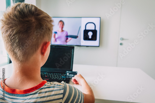 Fototapeta Naklejka Na Ścianę i Meble -  Teaching kid online security before paying online, safety on internet