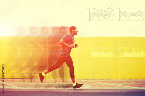 Full length portrait of male runner with muscular body in tracksuit jogging against yellow wall with copy space area for text message or content, Motion blur effect with progress infographics diagrams © BullRun