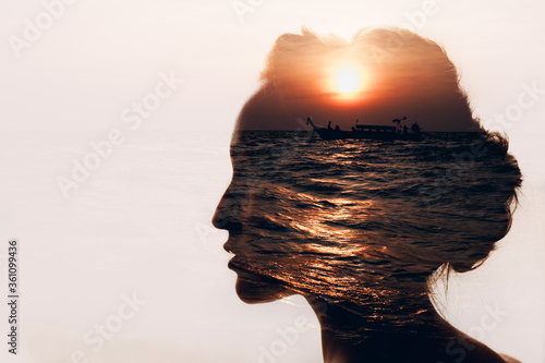 Woman with sun, boat and clouds in her head.