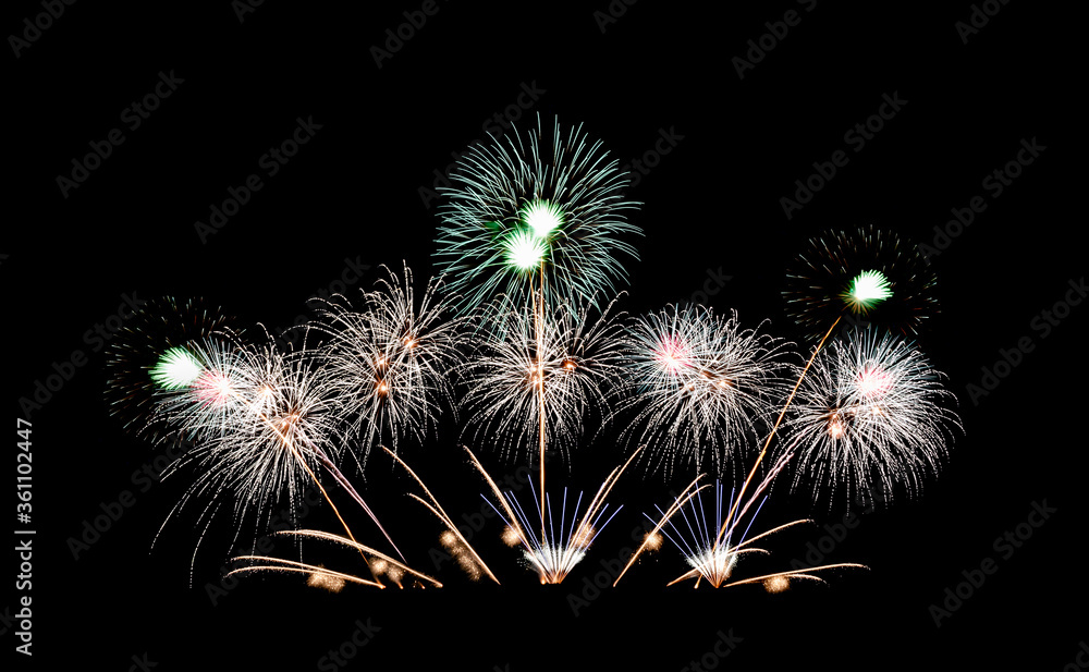 Beautiful fireworks light up in night sky. New Year celebration firework isolated on black background. Beautiful fireworks light up in night sky. New Year celebration firework isolated on black background.