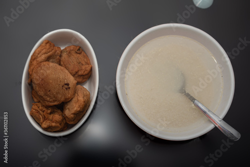 A picture of fried beans cake and garri photo