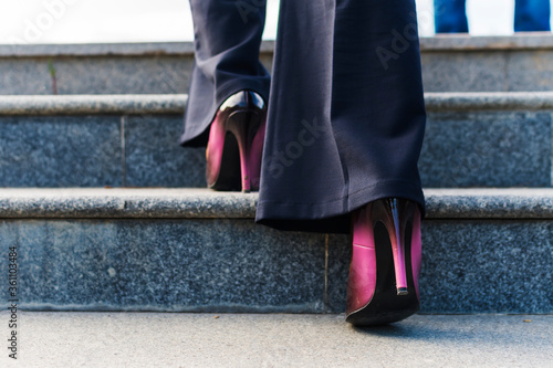 business woman climbs the stairs. Feet on the steps © Mariia Nazarova