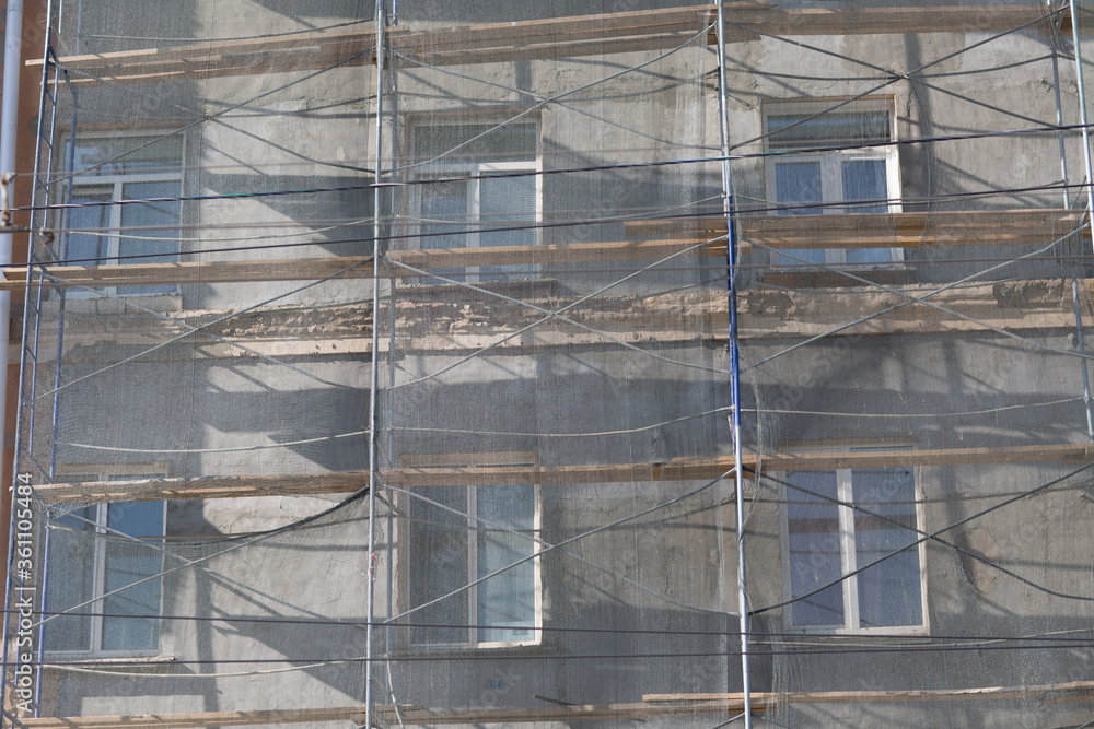 Scaffolding on building house in the city