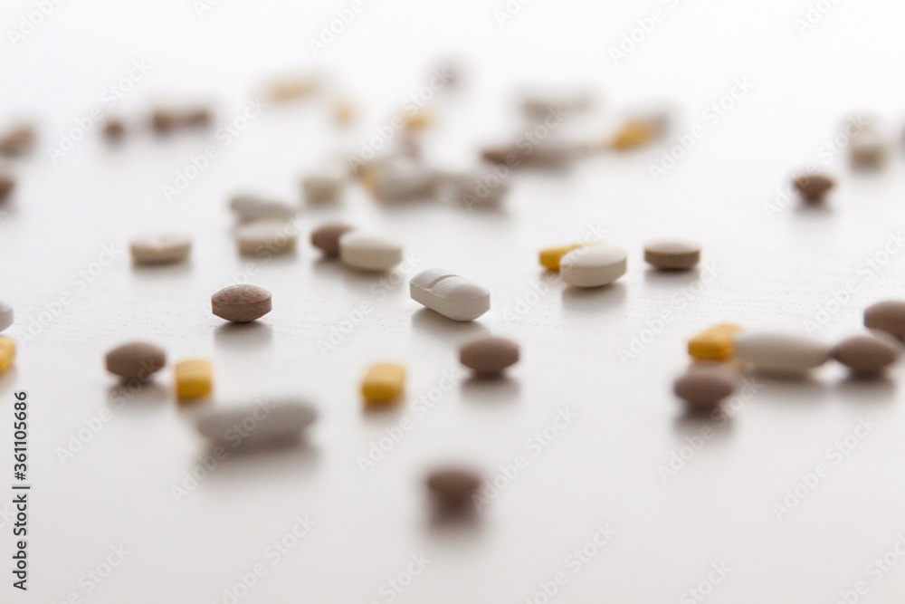 White background with randomly scattered tablets. White background with randomly scattered tablets.