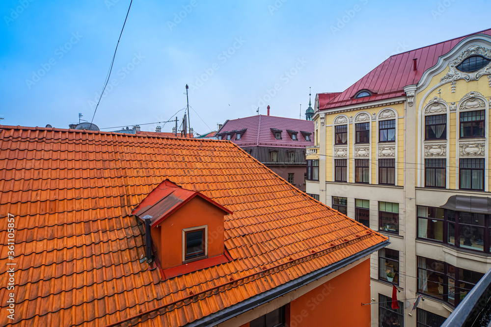 Traditional architecture of Old town of Riga, Latvia. Close-up of red tile roof. Modern exterior.