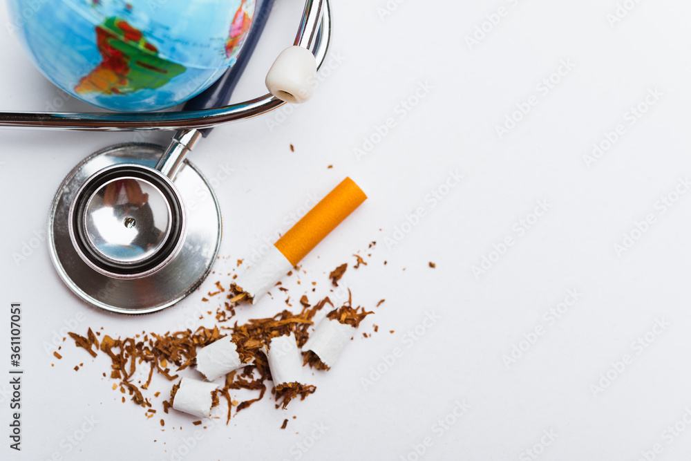 Fototapeta premium broken pile cigarette or tobacco and doctor stethoscope