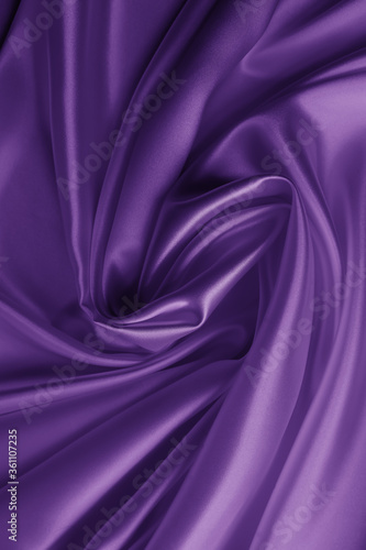 Beautiful smooth elegant wavy violet purple satin silk luxury cloth fabric texture  abstract background design. Card or banner.