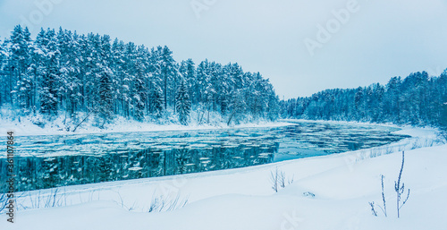 beautiful winter background of snowy forest and river 