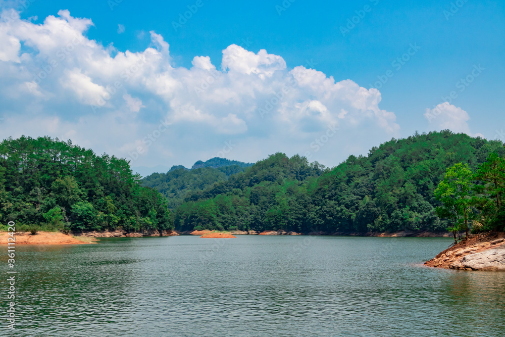 Fototapeta premium Landscape on the lake. The distant woods.