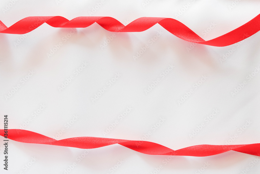 Obraz premium red ribbon on white background