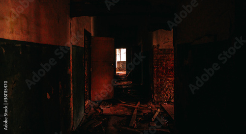 Creepy long corridor in an abandoned building with a window at the end, Silent Hill style