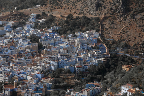 Street with stairs in Medina of Chefchaouen, Morocco. Chefchaouen or Chaouen is known that the houses in this old town are painted in the striking, variously blue hued 