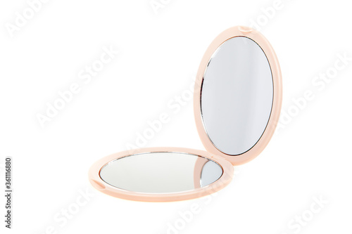 Small round cosmetic pocket mirror isolated on white. Open