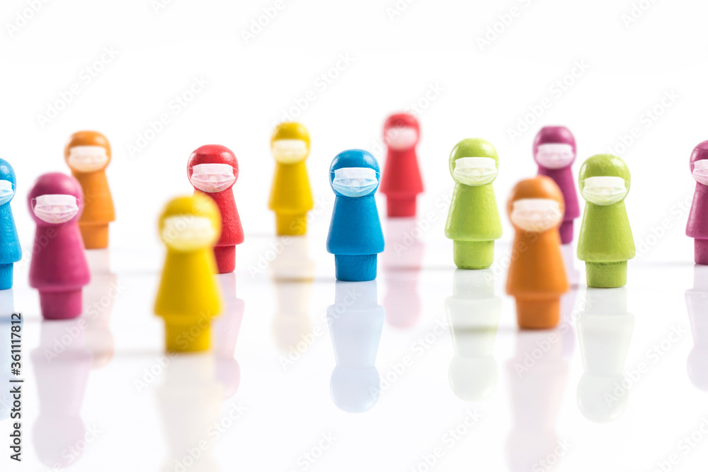 A wooden chess piece shaped like a human figure wearing a mask A wooden chess piece shaped like a human figure wearing a mask