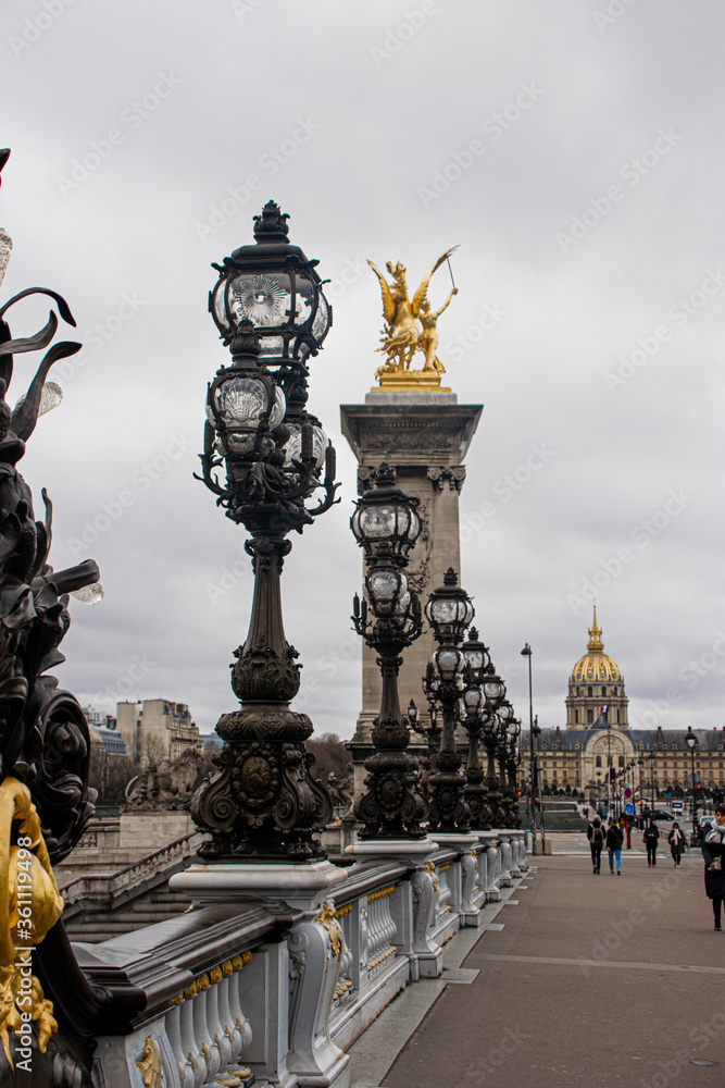 Obraz premium Photo of Alexander III bridge in Paris during a cloudy day