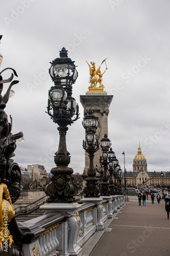 Photo of Alexander III bridge in Paris during a cloudy day © Irene Castro Moreno
