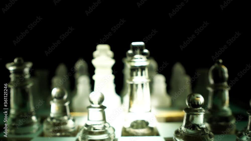 The concept of business competition: Close-up of a businessman holding a glass chess 4K The concept of business competition: Close-up of a businessman holding a glass chess 4K