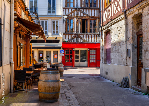 Street with timber framing houses and tables of restaurant in Rouen, Normandy, FranceArchitecture and landmarks of Rouen. Cozy cityscape of Rouen © Ekaterina Belova