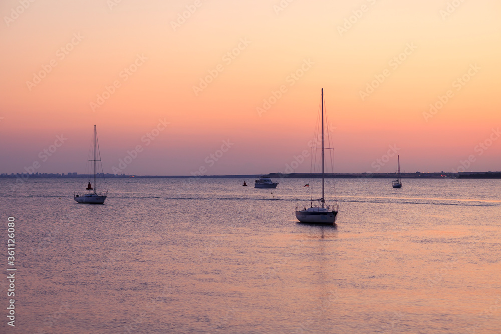 Yachts. Beautiful sunset over the bay of Pomorie. Black Sea. Bulgaria.