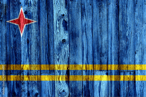 aruba flag on old wood texture background photo