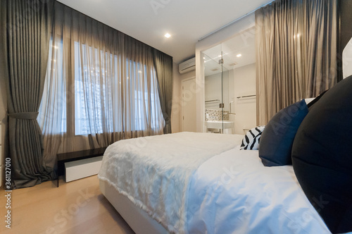 Bright Interior of cozy bedroom in modern design