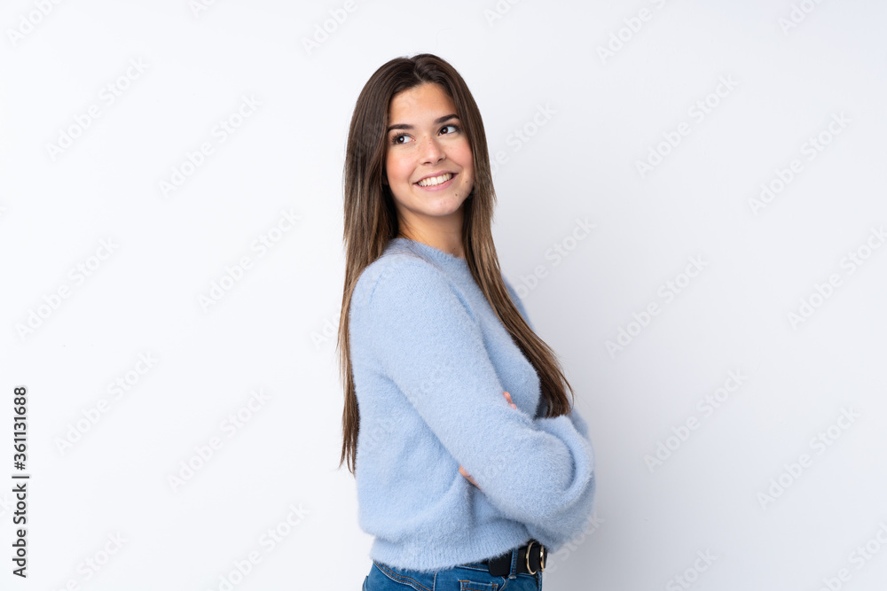 Teenager girl over isolated white background with arms crossed and happy Teenager girl over isolated white background with arms crossed and happy