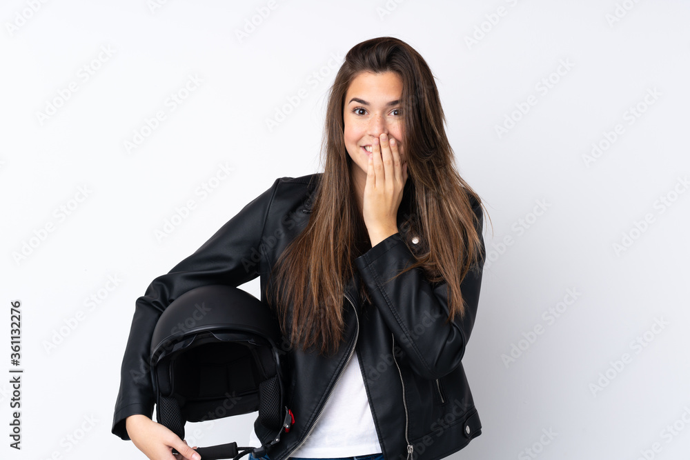 Young woman with a motorcycle helmet over isolated white background with surprise facial expression Young woman with a motorcycle helmet over isolated white background with surprise facial expression