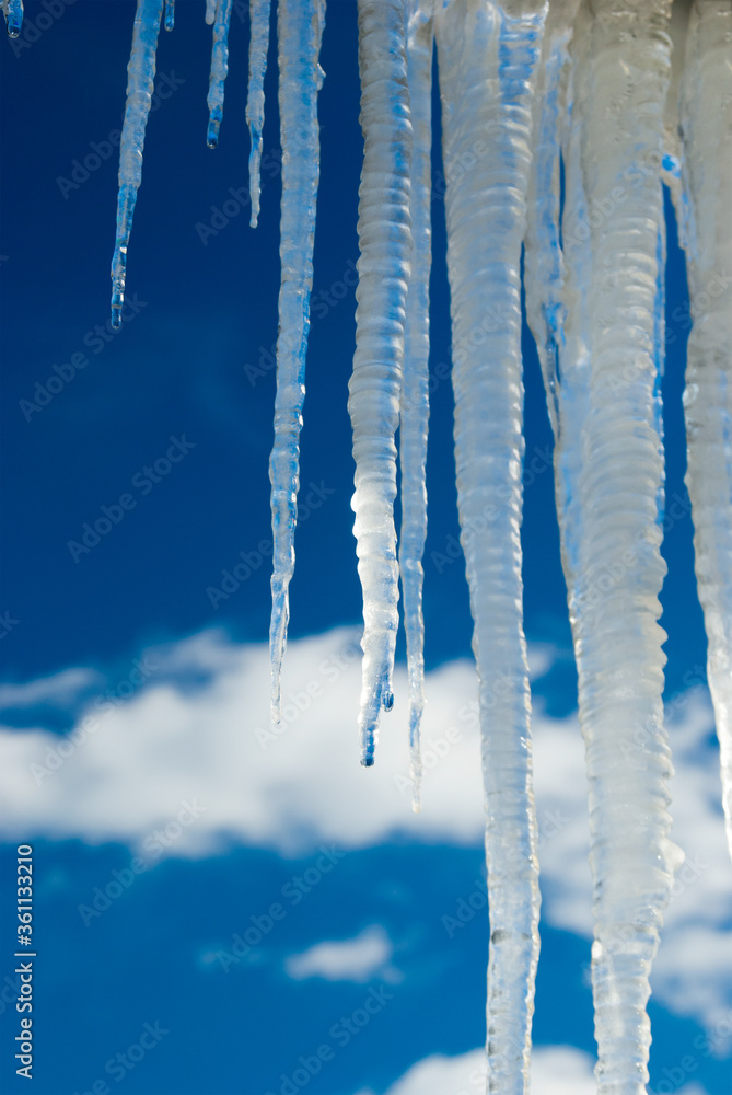 melting icicles under the roof, the arrival of spring melting icicles under the roof, the arrival of spring
