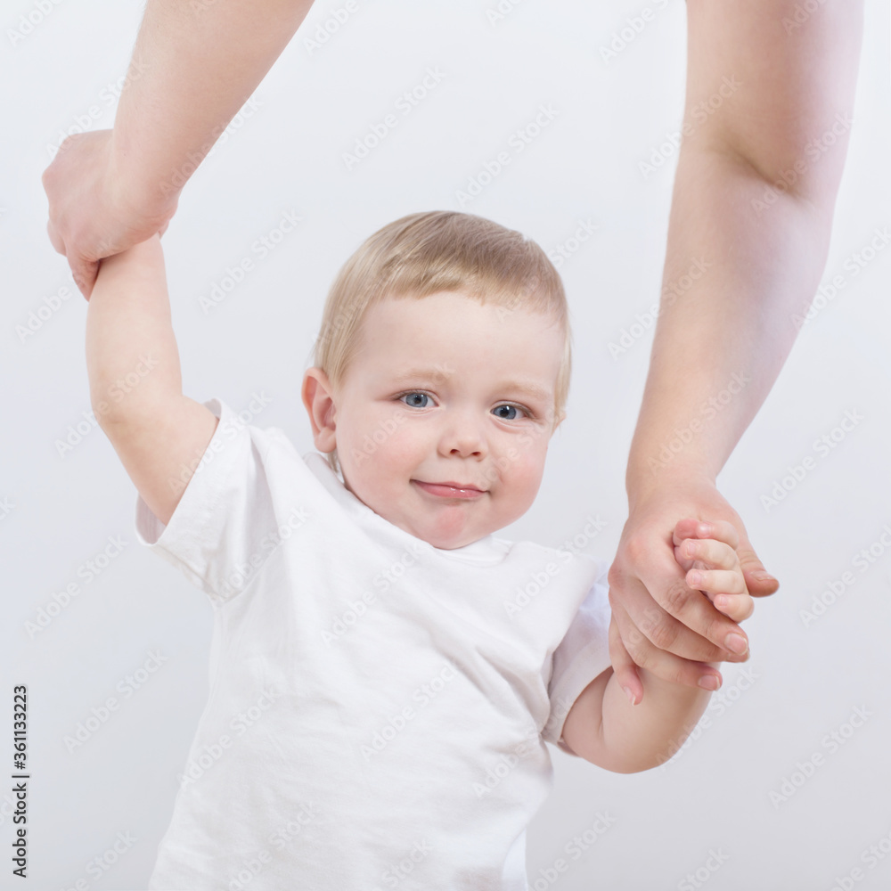 baby takes first steps holding mom's hand baby takes first steps holding mom's hand