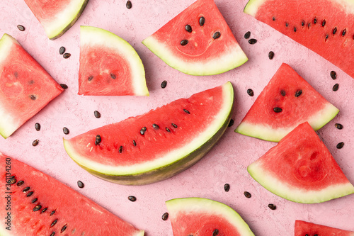 Composition with watermelon slices on pink background, top view