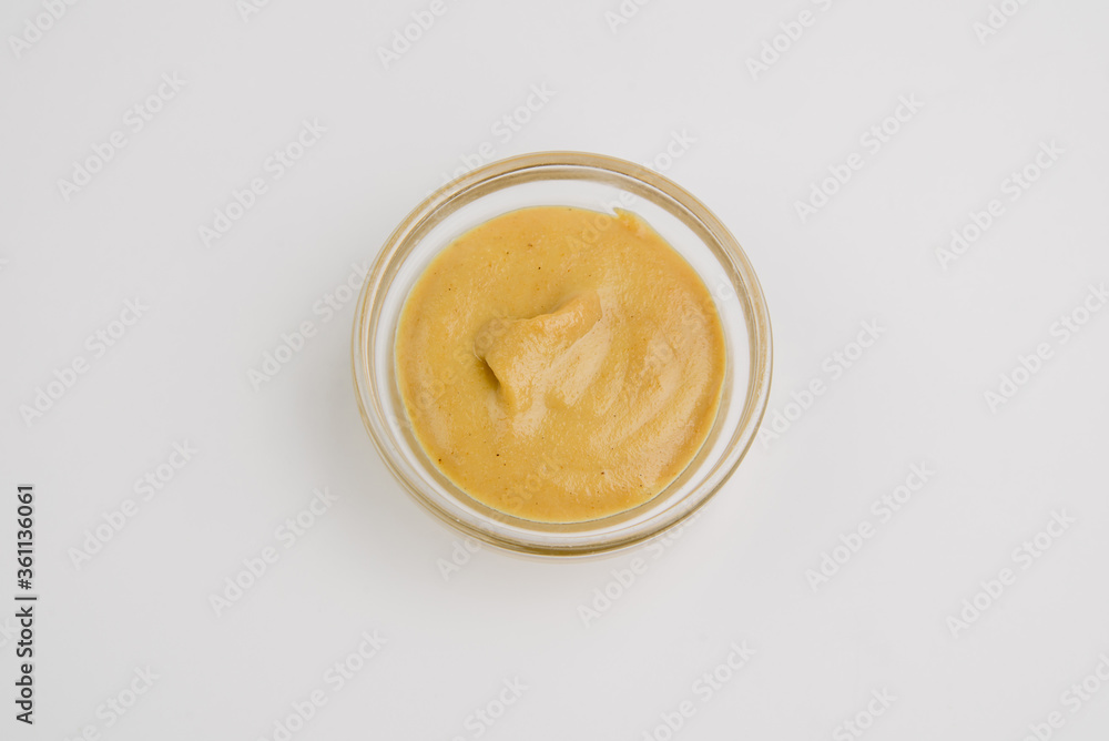 Mustard. Mustard in a gravy boat. Mustard sauce on white Mustard. Mustard in a gravy boat. Mustard sauce on white