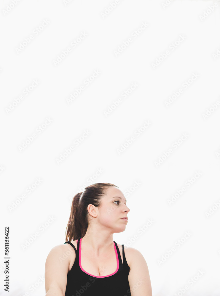 Front view of the determined look of a young woman wearing sportswear after a fitness session Front view of the determined look of a young woman wearing sportswear after a fitness session